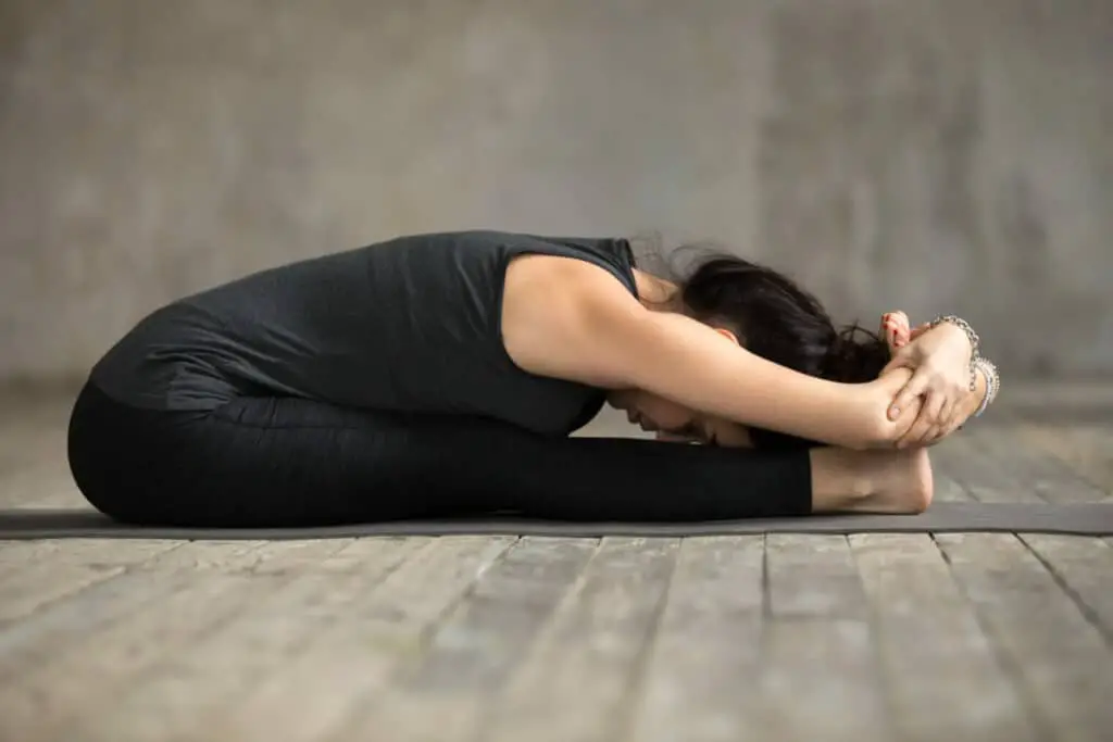 Triple forward fold yoga pose